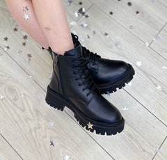 Black winter leather boots on fur