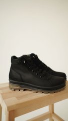 Black leather winter boots on wool felt