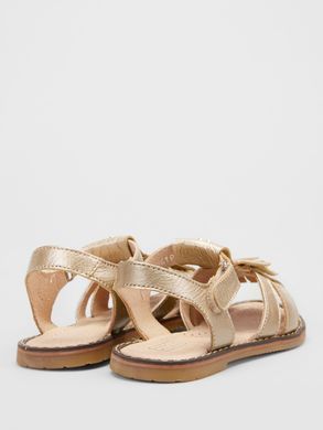 Gold leather sandals with fringes