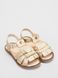 Gold leather sandals with fringes