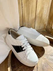 White leather sneakers with black inserts