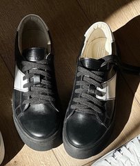 Black leather sneakers with white inserts