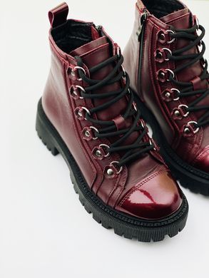 Burgundy winter leather boots on fur