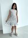 Gray cotton dress with a bow at the back and trim at the bottom for a girl