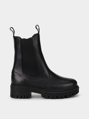 Black leather winter chelsea boots on fur