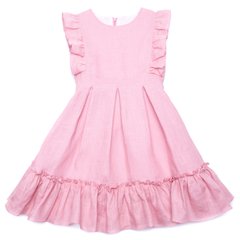 Pink linen dress with a bow at the back and ruffles on the shoulders and bottom for a girl