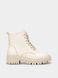 Beige winter leather boots on fur