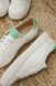 White leather sneakers with green inserts