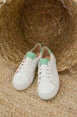 White leather sneakers with green inserts