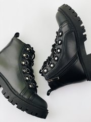 Black winter leather boots on fur
