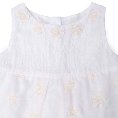 Milk cotton sundress with soft yellow flowers and bow on buttons at the back for girls