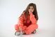 Warm coral-colored pants for girls