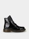 Black winter boots with patent leather on fur