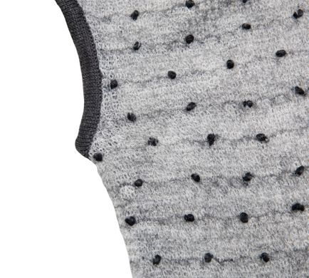Gray knitted vest with black dots for a girl